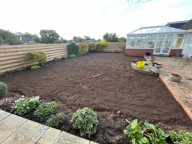 Bare soil raked in preparation for fresh turf